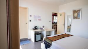 Postel nebo postele na pokoji v ubytování Silver Oasis Maldives