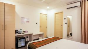 Postel nebo postele na pokoji v ubytování Silver Oasis Maldives