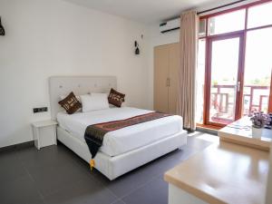 Postel nebo postele na pokoji v ubytování Silver Oasis Maldives