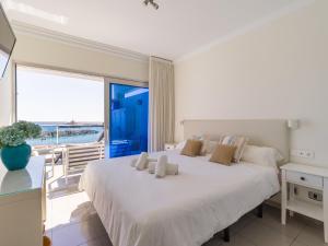 Postel nebo postele na pokoji v ubytování Mogan Beachfront | CarmitAtHome + 24 fotografií