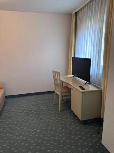 TV a/nebo společenská místnost v ubytování Hotel Graßer