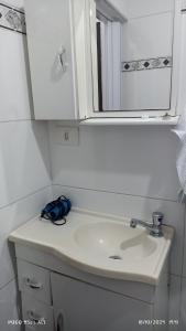 a bathroom with a sink and a mirror at CASA sobrado edícula aconchegante in São Paulo +45 photos