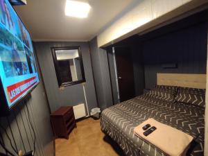 Postel nebo postele na pokoji v ubytování Hostal Santa