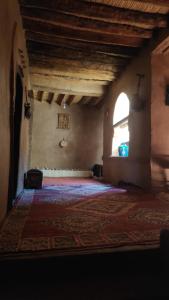 Postel nebo postele na pokoji v ubytování Kasbah Maktob Tamnougalt