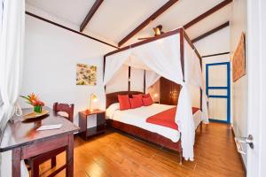 Voodi või voodid majutusasutuse Hotel El Encanto toas