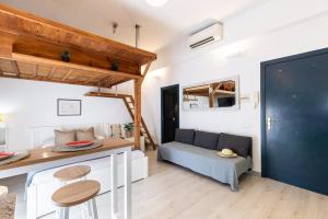 a room with a couch and a table in a room at Oli by Unik Vacation in Tarragona