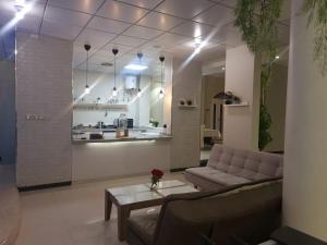a living room with a couch and a table at شاليه قطر الندى - الطائف in Taif