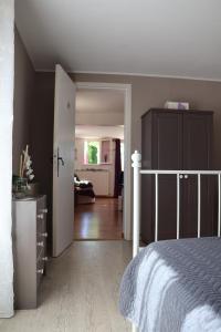 a bedroom with a bed and a door to a room at IA ORANA in Gargas +13 photos