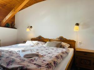 A bed or beds in a room at Penzión Hrubjak