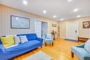a living room with a blue couch and two chairs at Cozy Colorado Springs Home Near Garden of the Gods in Colorado Springs