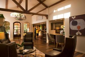 a living room filled with furniture and a large window at Vintners Resort in Santa Rosa