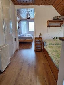 Postel nebo postele na pokoji v ubytování Szilva Apartman