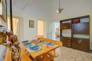 a dining room table with plates and dishes on it at Ca Moretto - Happy Rentals in Sanremo