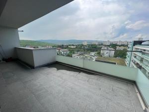 a balcony with a view of a city at City Vibe Apartments in Someşeni