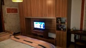 A television and/or entertainment centre at B&B Acquaria