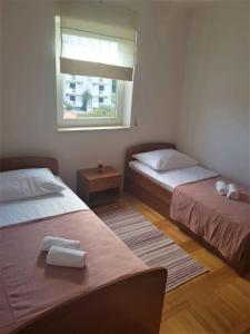 Posteľ alebo postele v izbe v ubytovaní Apartment Mari