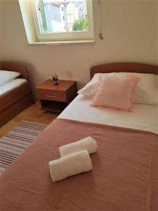 Posteľ alebo postele v izbe v ubytovaní Apartment Mari