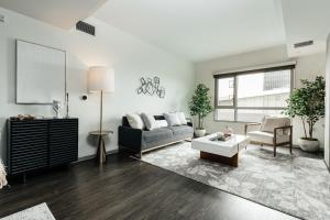 a living room with a couch and a table at Hollywood Designer Apartment in Los Angeles +36 photos