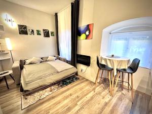 Postel nebo postele na pokoji v ubytování K&H Apartman