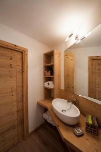 a bathroom with a sink and a mirror at Chalet Alfonz in Bormio +46 photos
