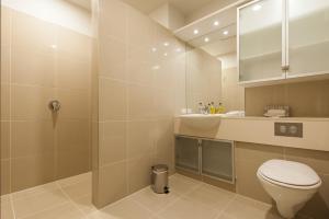 a bathroom with a toilet and a sink at Oxleys 406 3 bedroom Waterfront Apartment in Picton +10 photos