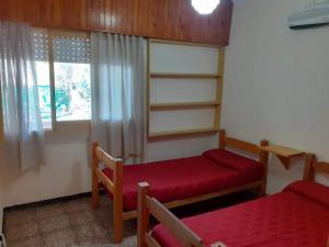 Ένα ή περισσότερα κρεβάτια σε δωμάτιο στο Casa Abuela Tere