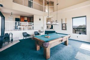 a billiard room with a pool table in it at Breathtaking view of the Hills with HotTub, Pool and Pool Table in Marble Mountain