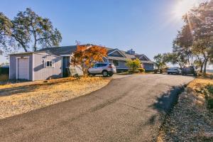 a house with cars parked on the side of a road at Breathtaking view of the Hills with HotTub, Pool and Pool Table in Marble Mountain