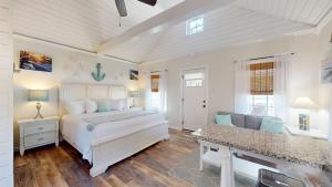 a white bedroom with a bed and a couch at Coastal Estate in Cape May +45 photos