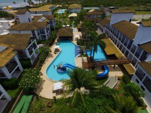 an aerial view of a pool at a resort at Apartamento 03 suítes - Tree Bies Beach Resort - Praia de Subaúma in Entre Rios +32 photos