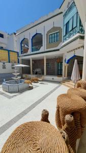 a large building with a large yard with a patio at Dar Morjana in Sousse