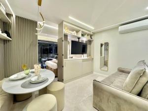 a living room with a couch and a table at 405 - Rentaqui Apartamento The Prime Moema in Sao Paulo
