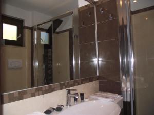 a bathroom with a sink and a mirror at Park Hotel Cilento in Marina di Camerota