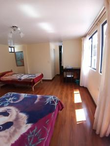 Voodi või voodid majutusasutuse Hostal Atlantis toas