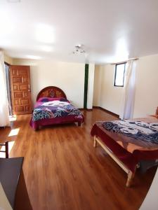 Voodi või voodid majutusasutuse Hostal Atlantis toas