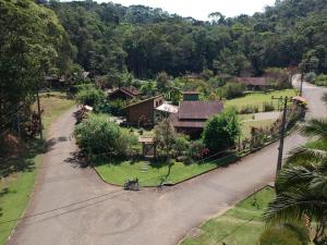 an overhead view of a house with a driveway at Casa do Bosque in Visconde De Maua