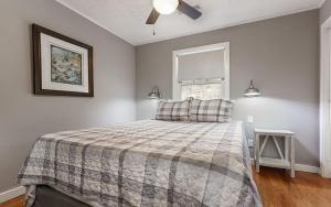 a bedroom with a bed and a window at Cottage On The Ridge in Sevierville