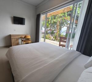 Ein Bett oder Betten in einem Zimmer der Unterkunft Lushy Hostel Nusa Penida