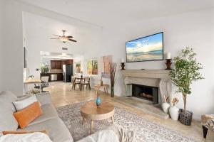 a living room with a couch and a fireplace at Luxury 4BD and 3BA in Topanga Oasis with Pool, Spa and Cabana in Glenview