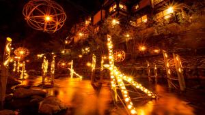 a bunch of lights in a park at night at コンテナハウスヴィラくろかわ in Minamioguni