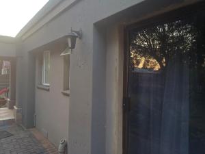 a door to a house with a window at Willow guest house in Vereeniging