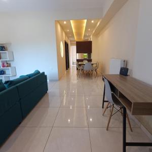 a living room with a couch and a table at Drosoula house in Chania Town