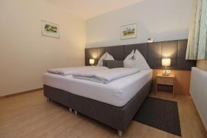 Posteľ alebo postele v izbe v ubytovaní Appartement Dallavia