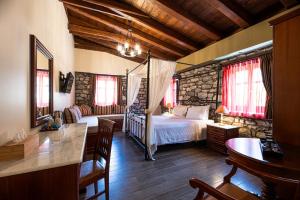Rúm í herbergi á Itilo Traditional Hotel