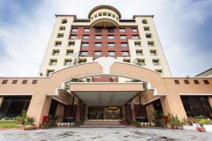 a building with an archway in front of it at Grand Hotel Kathmandu in Kathmandu