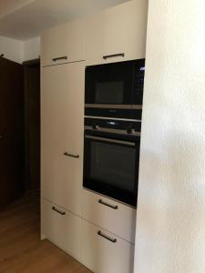 Kuchyň nebo kuchyňský kout v ubytování Saaserhof Apartments