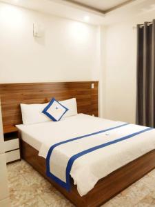Postel nebo postele na pokoji v ubytování Hotel Trần Long
