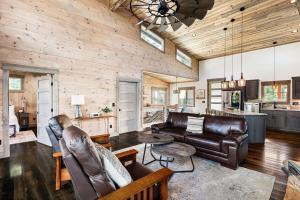 a living room with a couch and a table at Modern River Retreat NEW Build in 2022 in Blue Ridge