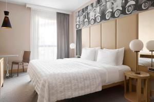 Postel nebo postele na pokoji v ubytování Le Meridien Visconti Rome + 37 fotografií