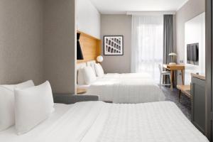 Postel nebo postele na pokoji v ubytování Le Meridien Visconti Rome